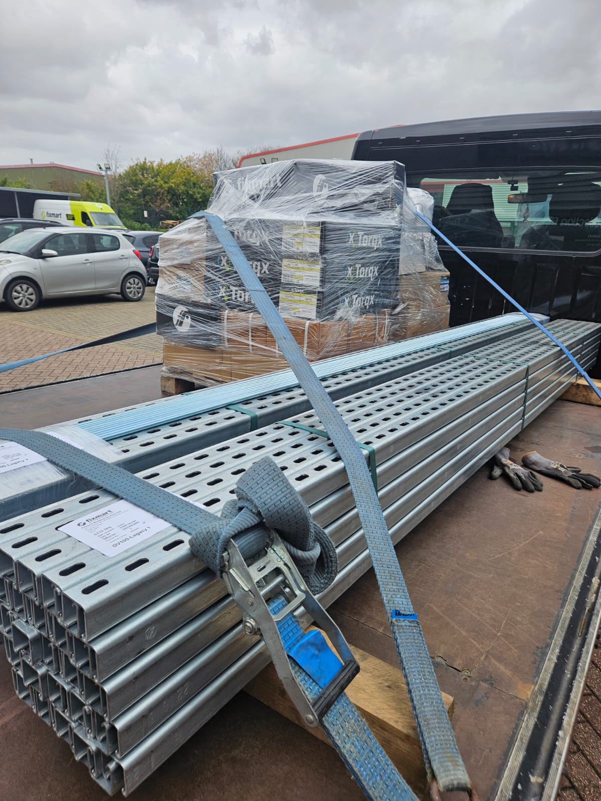 Strut channel and palletised fixings secured on a flatbed