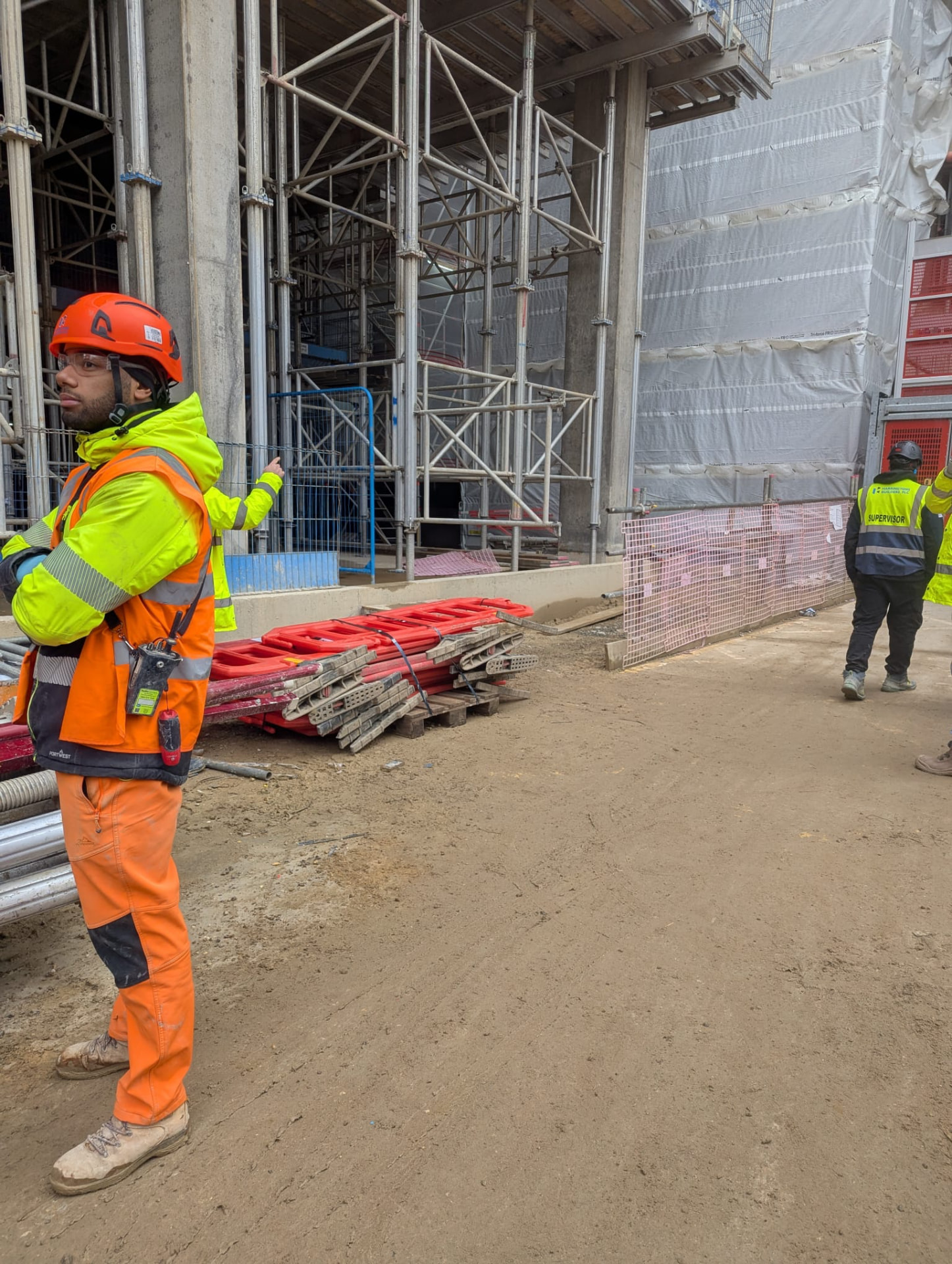 Site team receiving a delivery at a construction site